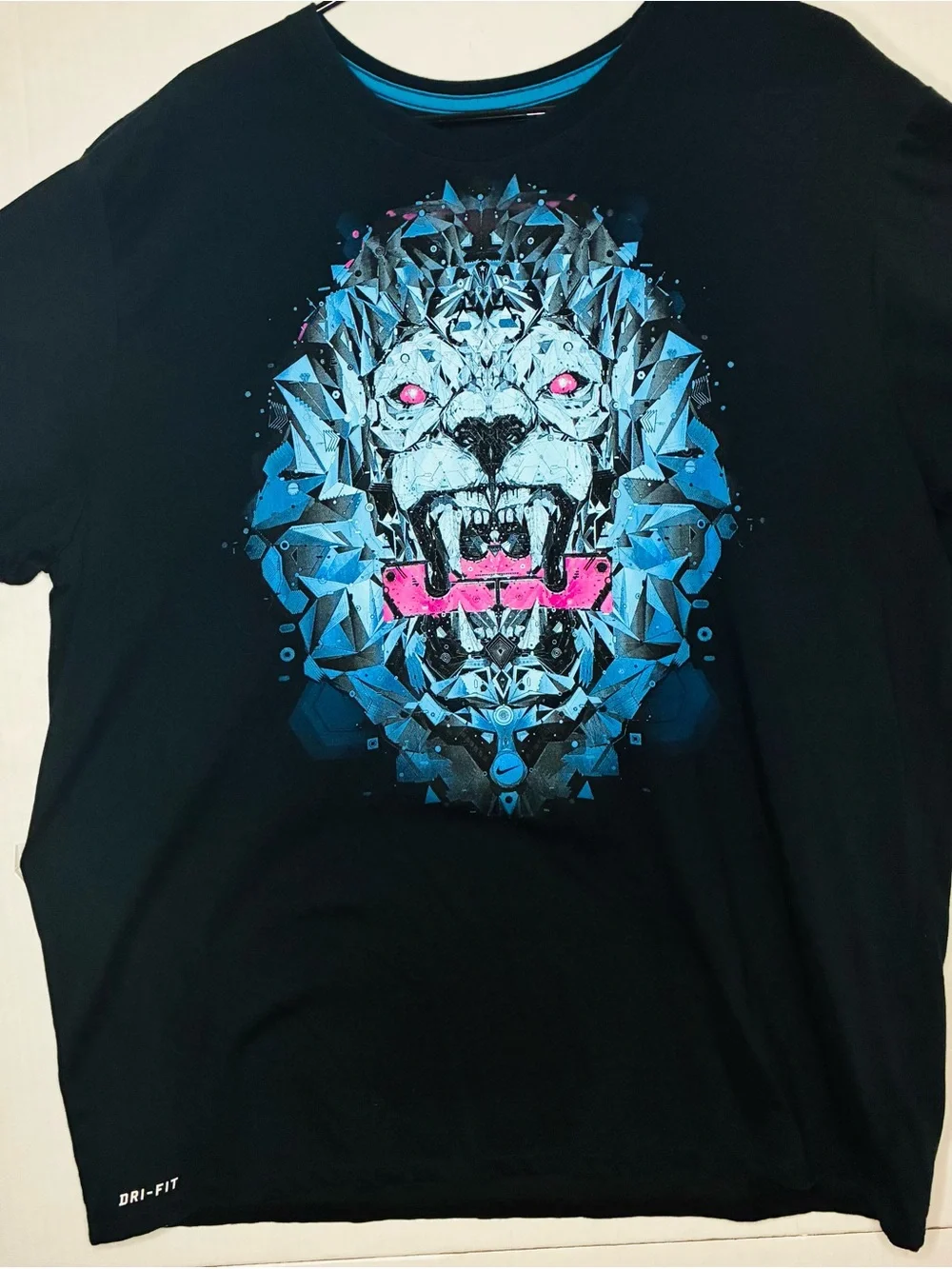 Nike Black Short Sleeve Tee with Blue Geometric Lion and Pink Accents
